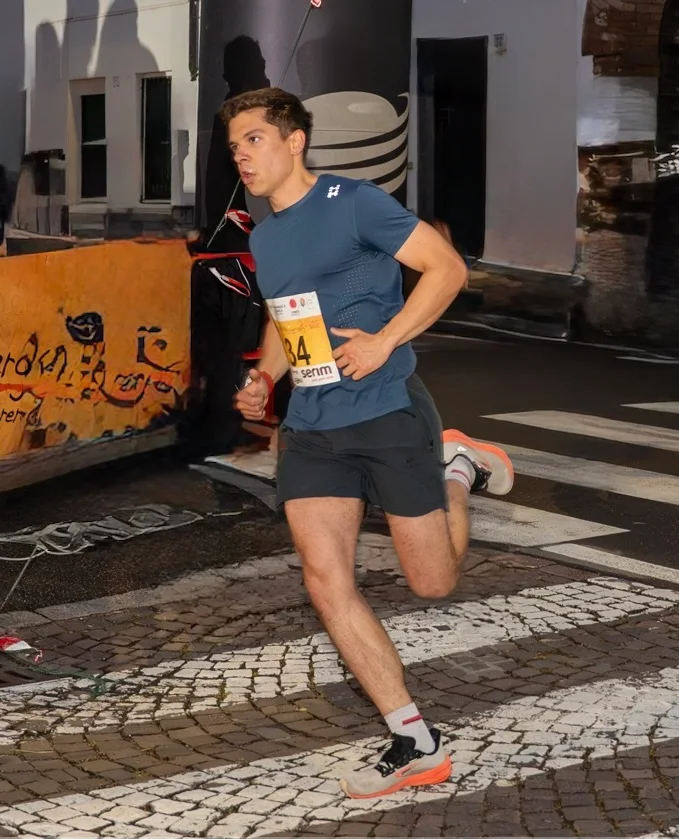 A runner taking part in an evening road race